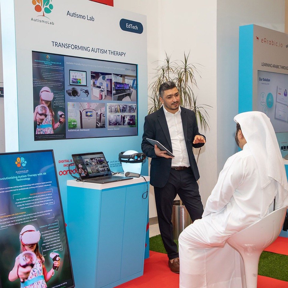Akram Hidri presenting AutismoLab at an exhibition booth